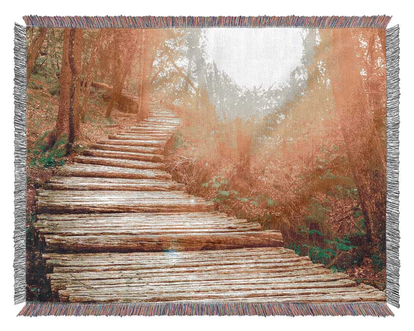 Log trail through the woods Woven Blanket