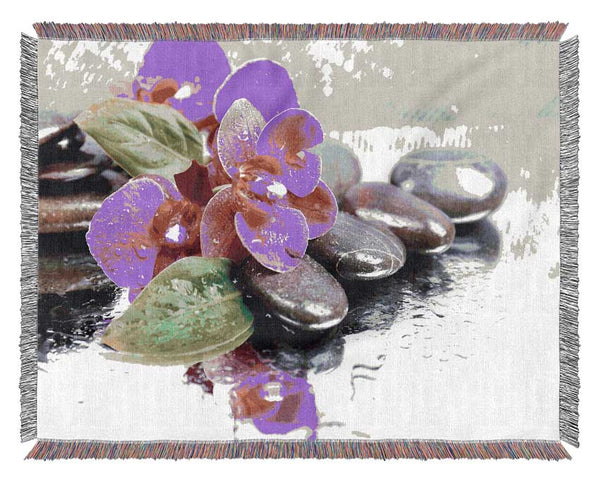 Orchids on the wet pebbles Woven Blanket