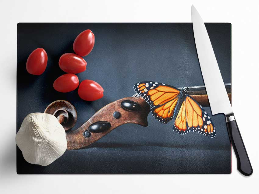 Butterfly resting on Instrument Glass Chopping Board