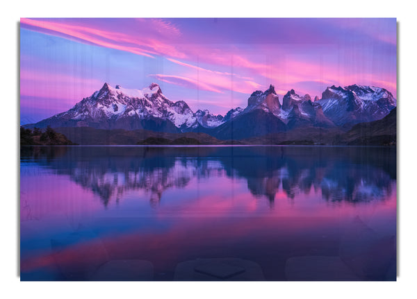 Purple and blue mountains above lake