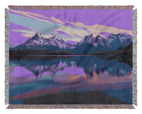 Purple and blue mountains above lake Woven Blanket