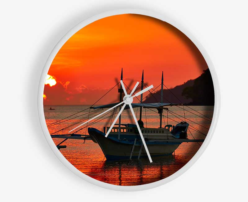 Boat sailing in the orange sunset Clock - Wallart-Direct UK