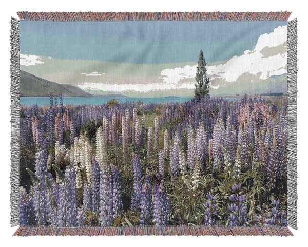 Loopins peering over the lake Woven Blanket