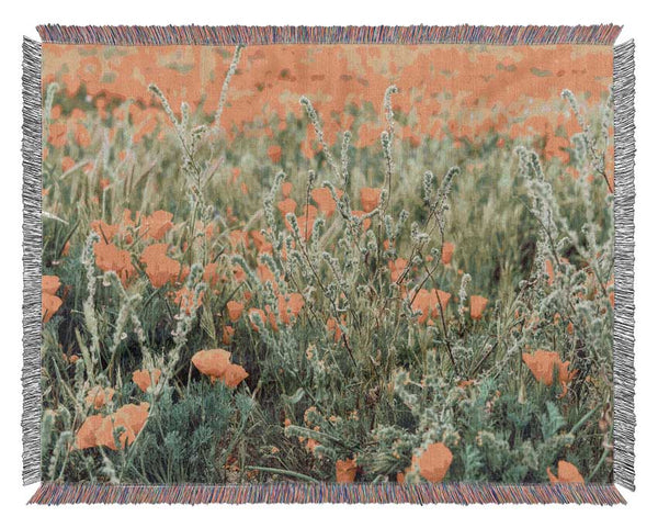 Orange flowers in the spring field Woven Blanket