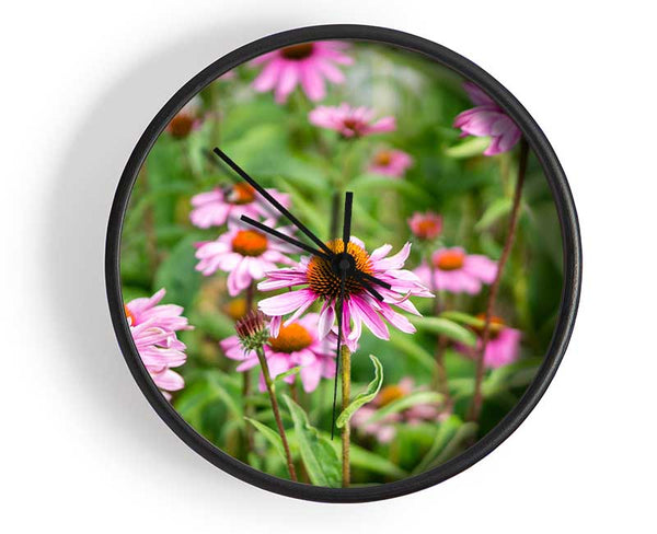 Pink flowers down below in the grass Clock - Wallart-Direct UK