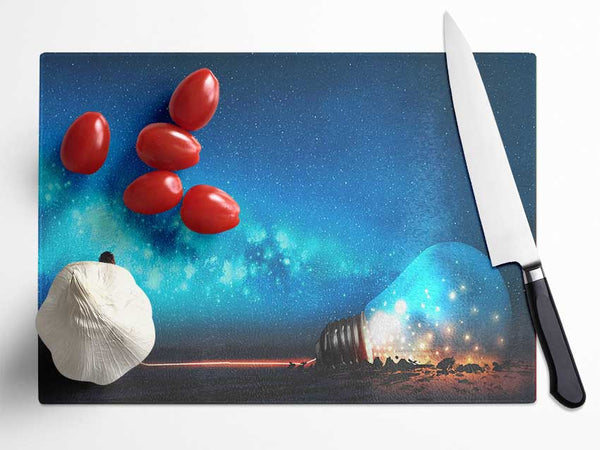 Child Pulling A Lightbulb Glass Chopping Board